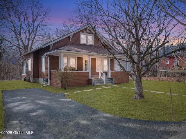 view of front of house with a yard