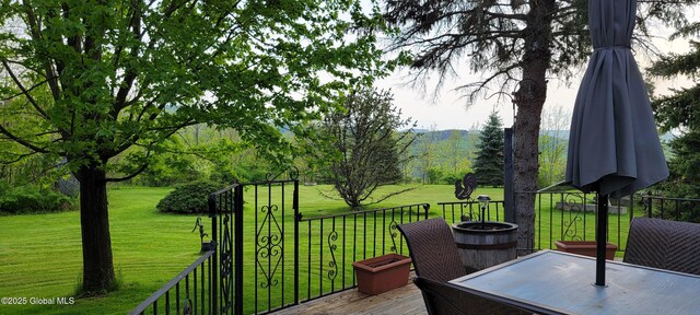 deck featuring a lawn