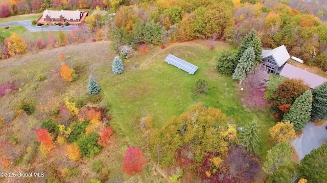 aerial view featuring a wooded view