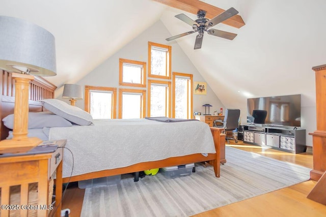 bedroom featuring lofted ceiling and wood finished floors