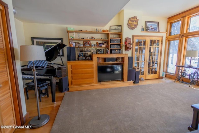 living room featuring light carpet and french doors