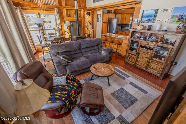 living area featuring wood finished floors and visible vents