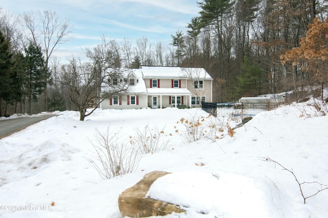 traditional-style house with fence