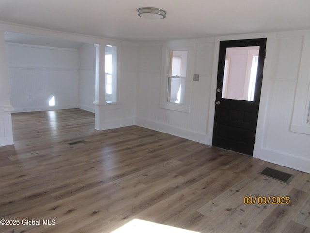 entryway featuring a healthy amount of sunlight, visible vents, and wood finished floors