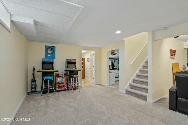 finished basement featuring recessed lighting, stairway, carpet flooring, and baseboards