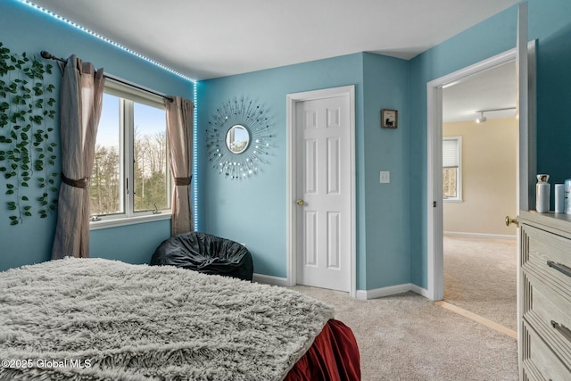 bedroom with baseboards and carpet floors