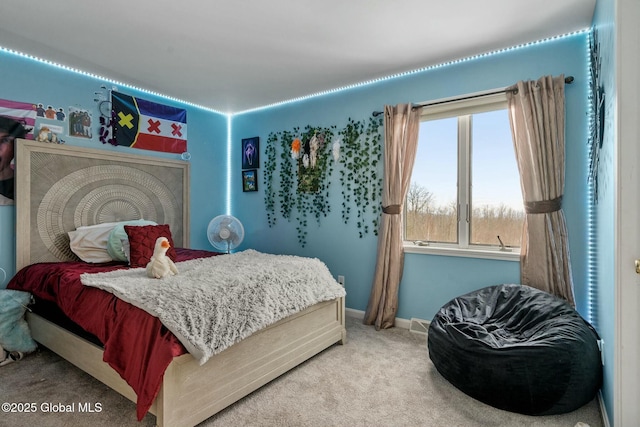 carpeted bedroom featuring baseboards