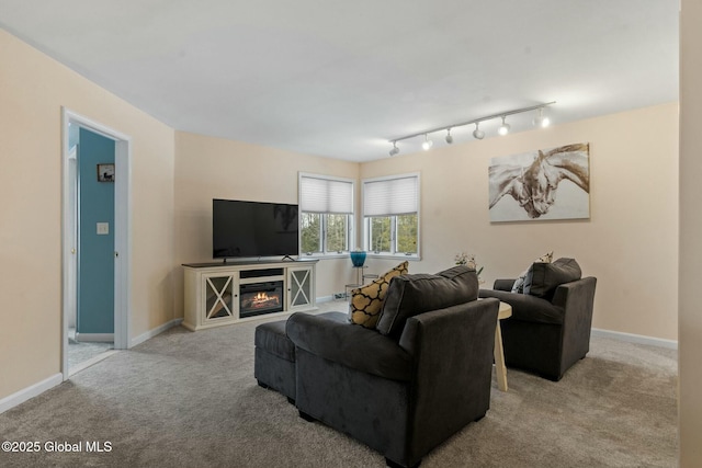 living room with baseboards and carpet