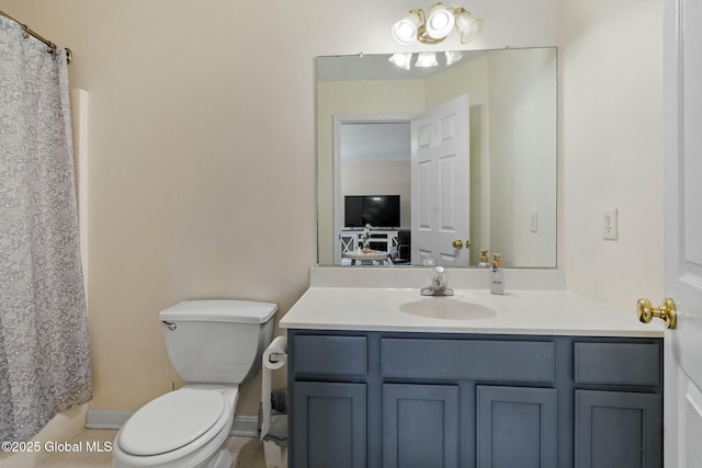 full bath with toilet and vanity