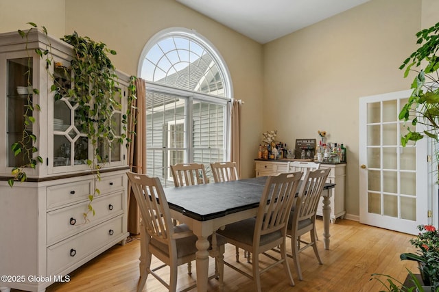 dining space with light wood-style flooring