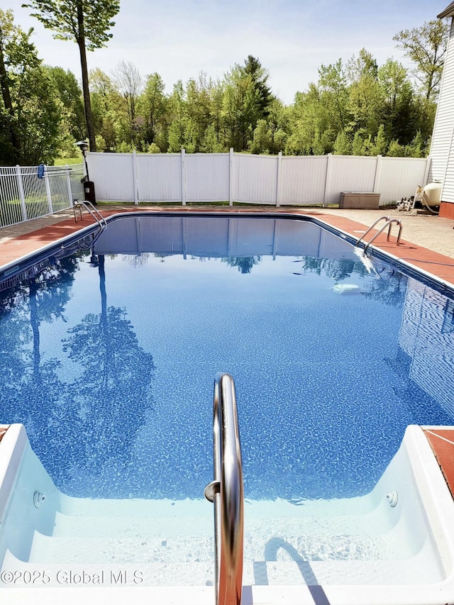 view of pool featuring a fenced in pool and fence