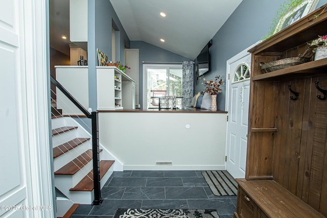 mudroom with lofted ceiling, baseboards, visible vents, and recessed lighting