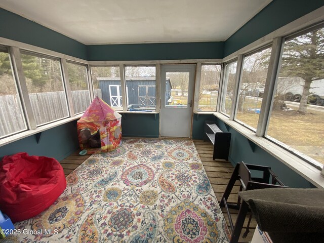 sunroom / solarium featuring plenty of natural light