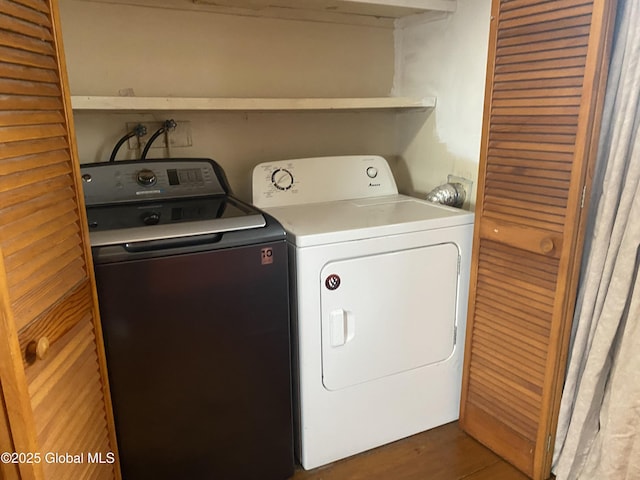 clothes washing area featuring laundry area and separate washer and dryer