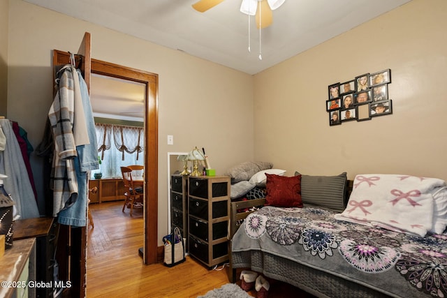 bedroom with ceiling fan and wood finished floors