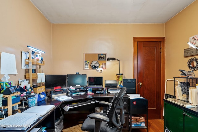 office space featuring wood finished floors