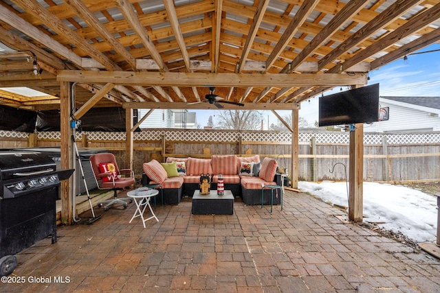 view of patio featuring fence and an outdoor hangout area