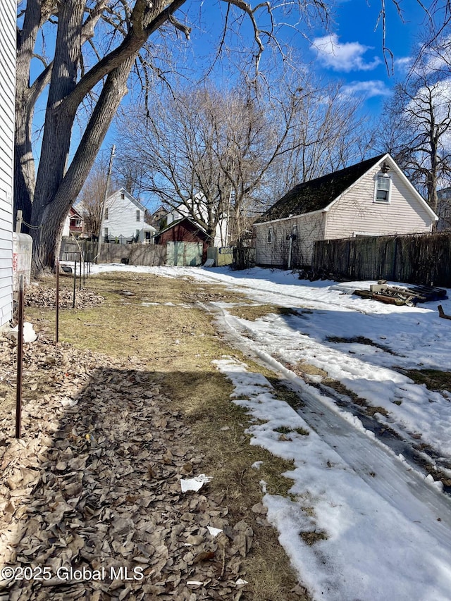 view of yard layered in snow