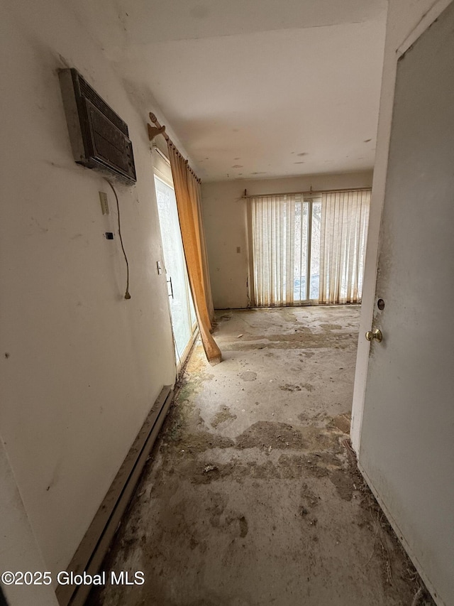 hallway featuring a wall unit AC