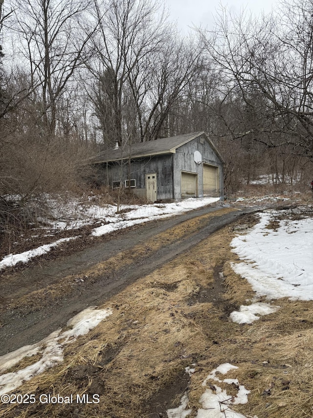 view of front of property with a detached garage