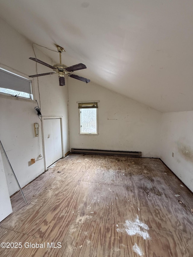 bonus room featuring vaulted ceiling, baseboard heating, and wood finished floors