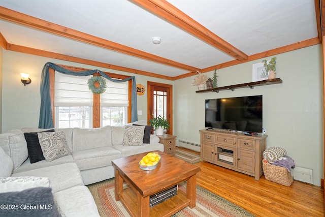 living area with a baseboard heating unit, beam ceiling, and light wood-style floors