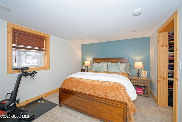 carpeted bedroom with baseboards