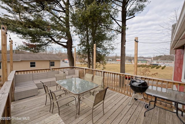 deck featuring outdoor dining area, an outdoor hangout area, and area for grilling