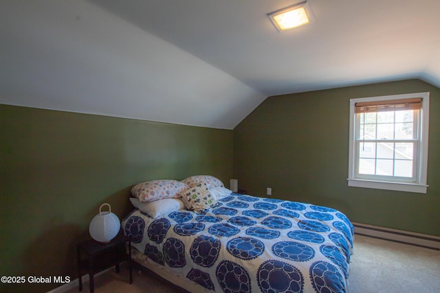 bedroom with vaulted ceiling, carpet flooring, and a baseboard radiator