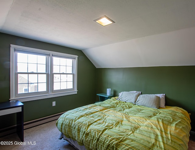 carpeted bedroom featuring a baseboard heating unit and lofted ceiling