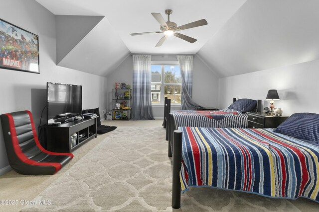 carpeted bedroom with a ceiling fan and vaulted ceiling