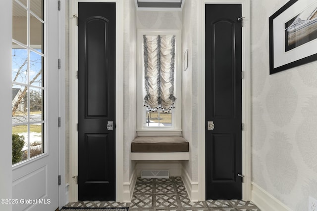 foyer featuring visible vents and baseboards