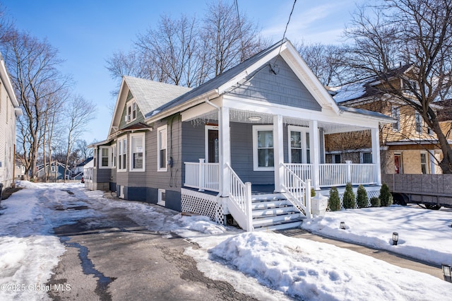 view of front of property with a porch and aphalt driveway