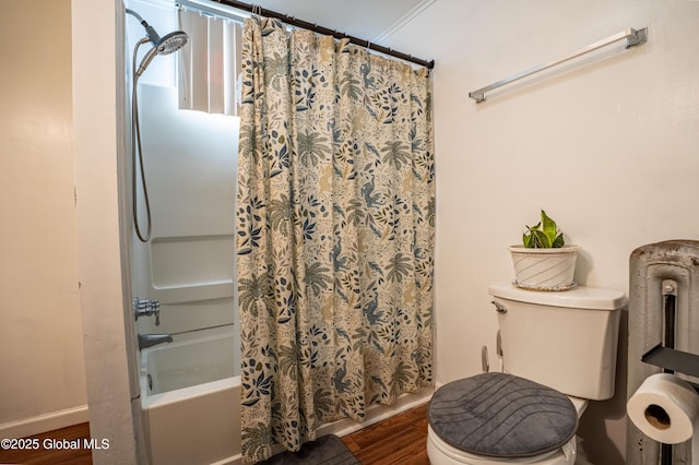 bathroom with toilet, shower / bath combo, baseboards, and wood finished floors