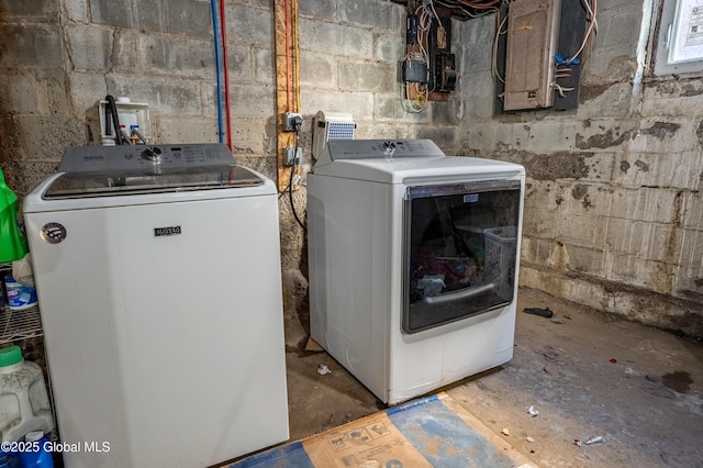 laundry area with washer and dryer, laundry area, and electric panel