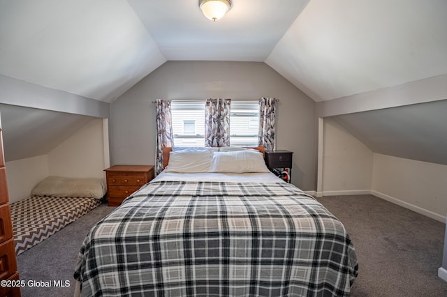 carpeted bedroom with vaulted ceiling and baseboards