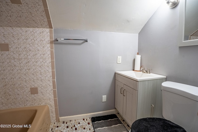 full bathroom featuring baseboards, vanity, and toilet