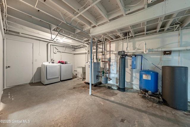 unfinished basement with a sink and washing machine and dryer