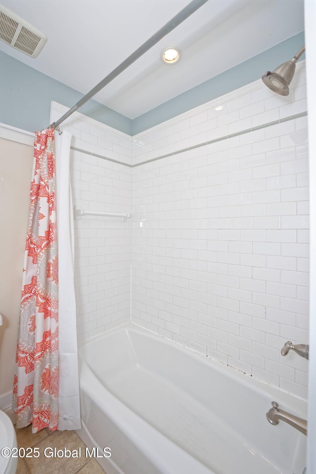 full bathroom with visible vents and shower / tub combo