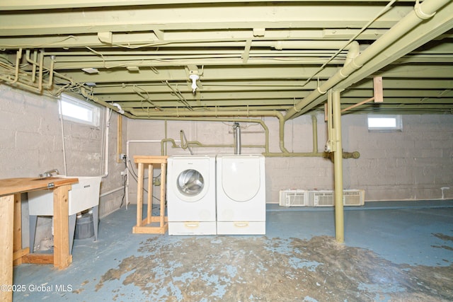 below grade area featuring washing machine and dryer