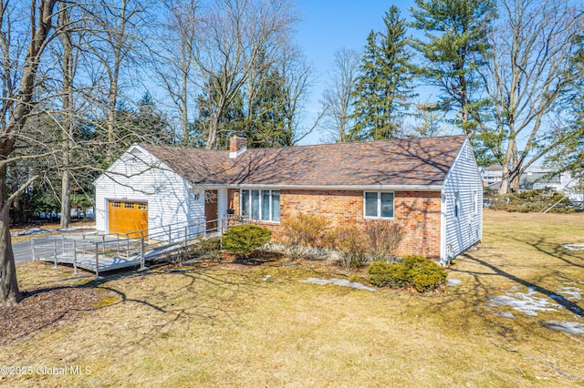 ranch-style home featuring a front lawn, brick siding, roof with shingles, and a chimney