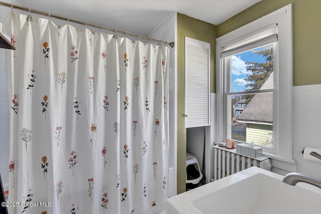 full bathroom with a sink and curtained shower