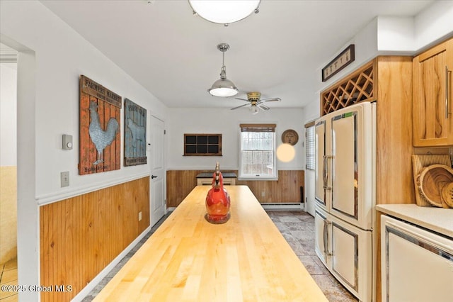 155 Andrews Rd, Carlisle, NY 12160 - kitchen featuring wooden walls, wooden counters, ceiling fan, a wainscoted wall, and baseboard heating