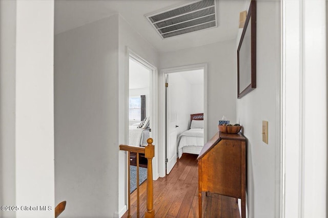 155 Andrews Rd, Carlisle, NY 12160 - hallway with hardwood / wood-style flooring, an upstairs landing, and visible vents