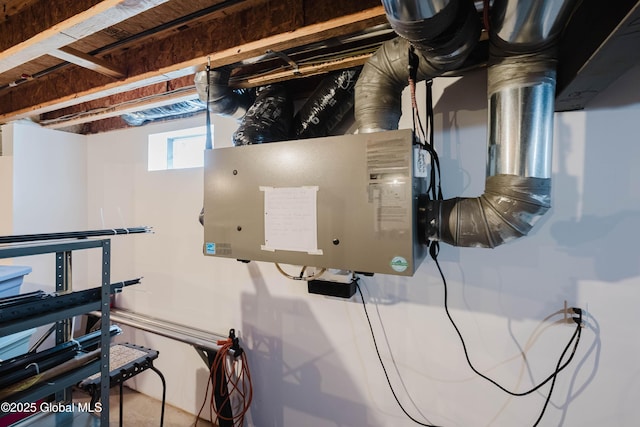 utility room featuring water heater