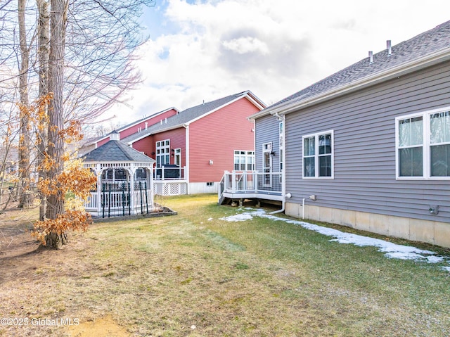 view of yard featuring a gazebo and a wooden deck