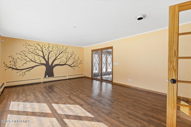 spare room featuring ornamental molding, a baseboard radiator, baseboards, and wood finished floors