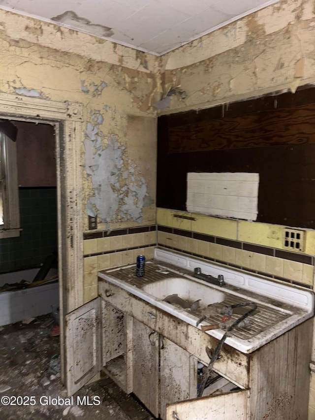 kitchen featuring wallpapered walls