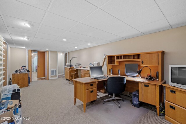 home office featuring light carpet, visible vents, recessed lighting, and a drop ceiling