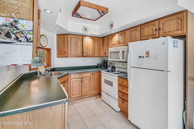 18 Johnson Ln, Poestenkill, NY 12018 - kitchen with white appliances, a tray ceiling, light tile patterned flooring, brown cabinetry, and recessed lighting